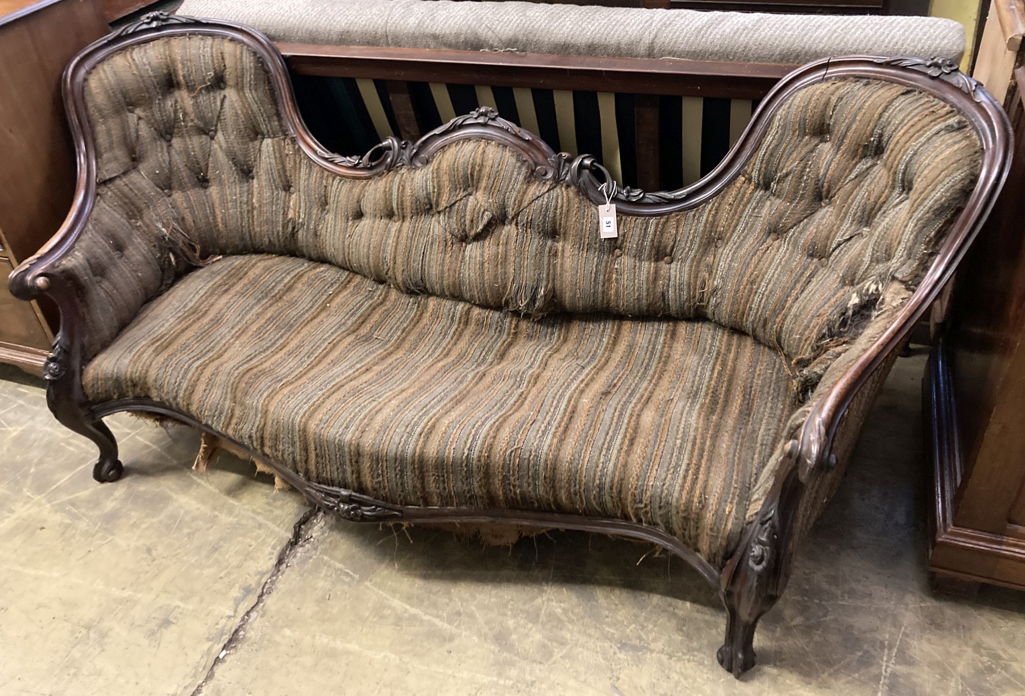 A Victorian carved walnut double spoon back settee, length 200cm, depth 90cm, height 84cm